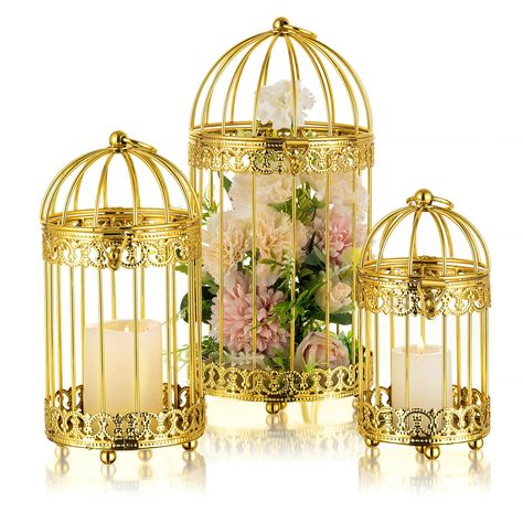 PRICES MAY VARY. 【Distressed Design】The NUPTIO birdcage lanterns candleholder is made of high-quality metal, with fine polishing, painting, and distressed craftsmanship, making it durable and resistant to corrosion. It not only serves as a candle holders for pillar candles, but also functions as a exquisite piece of artwork. This pillar candle holder is available in both gold and rustic white, adding a shabby chic and elegant atmosphere to your home or event decoration. 【Hanging & Sitting】The NU Art Deco Wedding Table, Modern Lantern Centerpieces, Vintage Table Decor, Candles Decor, Candle Centerpieces Wedding Round Table, Non Floral Wedding Centerpieces, Gold Cage Centerpiece, Rose Gold Lantern Centerpiece, Gold Table Lanterns