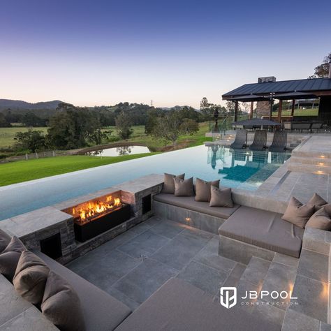 Which do you like best? Sunken fire pit? Raised fire lantern? One way to ensure year-round enjoyment of your swimming pool is to incorporate a fire or flame feature in the design.🔥 #OutdoorLifestyle #GoldCoastHomes #FireFeature Fire Pit In Pool, Fire Pit Next To Pool, Fire Pit Near Pool, Sunken Fire Pit, Raised Pools, Tamborine Mountain, Sunken Fire Pits, Pool Inspiration, Swimming Pool Landscaping