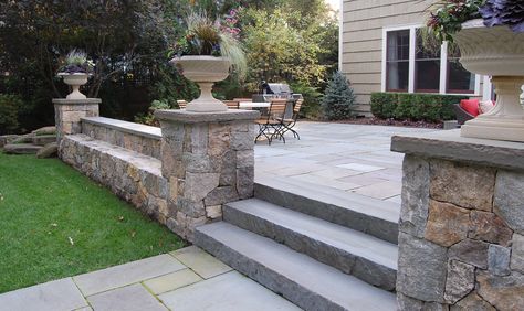 stone walls landscaping | Stone Seat Walls | Cording Landscape Design Stone Wall Patio, Stone Decking, Stone Wall Landscaping, Backyard Stone Wall, Stone Wall Around Patio, Walled Patio, Stone Patio With Railing, Stone Sitting Wall Patio Ideas, Low Stone Wall Around Patio