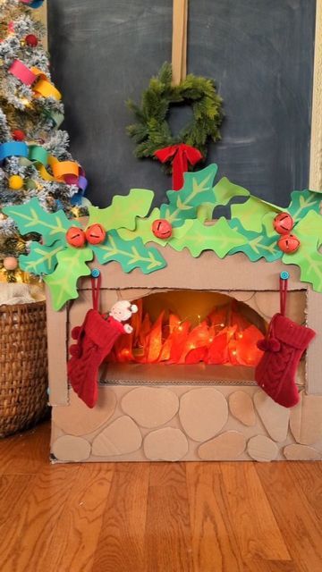 Studio Rosie on Instagram: "Cardboard Box Fireplace with Makedo 🎅 I used our @makedo tools to turn a cardboard box into a mantle, transforming our pizza oven into a cozy fireplace! The Makedo scrus are the perfect place to hang the stockings 😊 I love this Christmas update for our pizza oven. Rosie and Mae really love playing Santa and filling the stocking with surprises! Visit make.do/studiorosie10 (🔗 in bio) and use promo code STUDIOROSIE10 at checkout to get 10% off your order! #mymakedo #recycleandplay #recyclemeplay #craftcreateandmake #easycrafts #invitationtocreate #invitationtoplay #funbudgetplay #kidcrafts #toddlerplayideas #cardboardcrafts #christmascrafts #diychristmas #christmasactivities #festiveplayalltheway" Cardboard Box Fireplace, Box Fireplace, Empty Fireplace Ideas, Santa's Grotto, Diy Christmas Fireplace, Cardboard Fireplace, Holiday Photoshoot, Make Do, Diy Fireplace