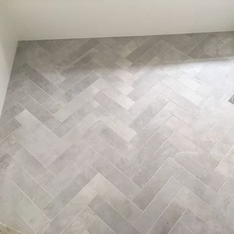 Teranova Grey Herringbone Floor Bathroom, Dark Herringbone Bathroom Floor, Marble Tile Half Way Up Bathroom Wall, Entry Hall Flooring Ideas, Grey Herringbone Tile Bathroom Floor, Mosaic Tile Floor Entrance, Herringbone Tile Floor Laundry Room, Gray Herringbone Tile Floor Bathroom, Grey Floor Tile Bathroom