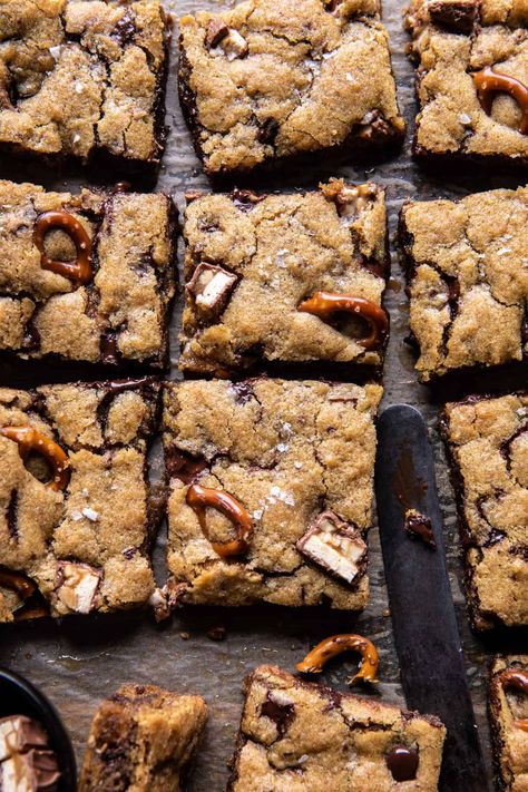 Pretzel Snickers Chocolate Chip Cookie Bars | halfbakedharvest.com Cookie Base Recipe, Snickers Chocolate, Snickers Candy Bar, Half Baked Harvest Recipes, Smores Dessert, Snickers Candy, Salted Pretzel, Desserts Keto, Peanut Butter Chocolate Bars