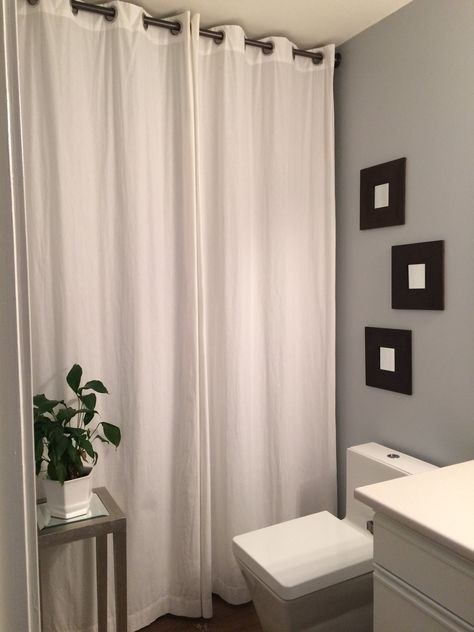 BATHROOM DRAPES: Use a Full Height Drape in a Full Bathroom to create the look of a Powder Room.  Hide ugly tiles or a tub of toys. Use with my HOME DECOR PLANNERS. Shower Curtains Over Glass Doors, Bathroom Drapes, Neutral Bathroom Decor, Neutral Bathroom, First Apartment Decorating, Pretty Bathrooms, Restroom Decor, Guest Bathrooms, Curtain Ideas