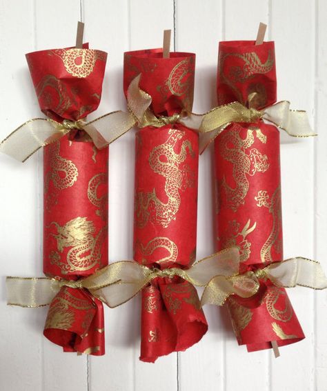 Celebrate with the Dragon Party Cracker is wrapped in handmade paper from Nepal and tied with gold wired ribbon. The highlight of every occision Chinese Theme Parties, Chinese New Year Calendar, Asian Party Themes, Office Xmas Party, Chinese Christmas, Chinese Party, Asian Party, Party Crackers, Chinese New Year Party