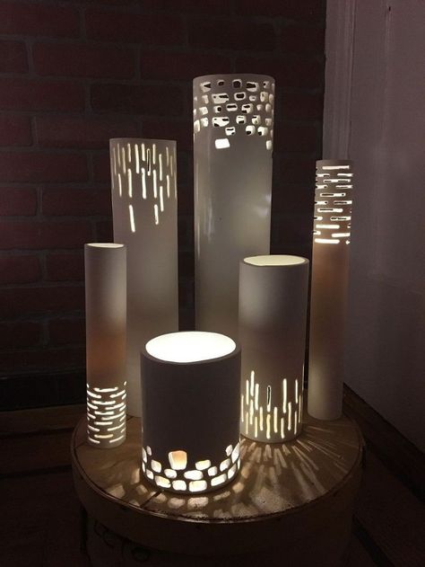 Turn PVC Pipes into Luminaries What if you put a plant in the top of one of these. Would have to be a pot in a pot in order to take it out and water. Interesting Ceramic Lanterns, Pvc Pipe Fittings, Craft Supply Storage, Canvas Drop Cloths, Pvc Pipe Projects, Metal Napkin Rings, Pvc Projects, Pipe Lighting, Pvc Pipe