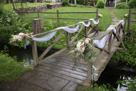 Lovely white tulle with beautiful bouquets of fresh flowers gracefully drapes the bridge at The Inn at Millrace Pond. Designed by Bilancia Designs for Renee & Rajeev's wedding/Lauren Dehrone Photography Bridge Decorations Ideas, Bridge Wedding Ceremony, Riverside Wedding Decorations, Bridge Flowers Wedding, Wedding On A Bridge, Decorating A Bridge For A Wedding, Wedding Pond Decorations, Outdoor Wedding Railing Decor, Outdoor Pond Wedding Ceremony