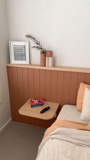 Surround by Laminex on Instagram: "This stunning project by @hammerandstone_workroom features our timeless Classic VJ 100 profile painted in @duluxaus Clay Court as a wall to wall bed head with a decorative ledge - Perfect for adding finishing touches to complete the space. Easy to install and ready to paint, this single wall feature adds so much depth and texture to this bedroom. Spruce up your room this Spring with Surround by Laminex. Love this look? Visit the link in our bio for more inspir Accent Wall Studio, Bed With Ledge Behind, Wall Painting Behind Bed, Bedroom With Ledge Wall, Vj Feature Wall, Entire Wall Headboard, No Headboard Wall Ideas, Bedroom Ledge Wall, Half Wall Ledge Bedroom