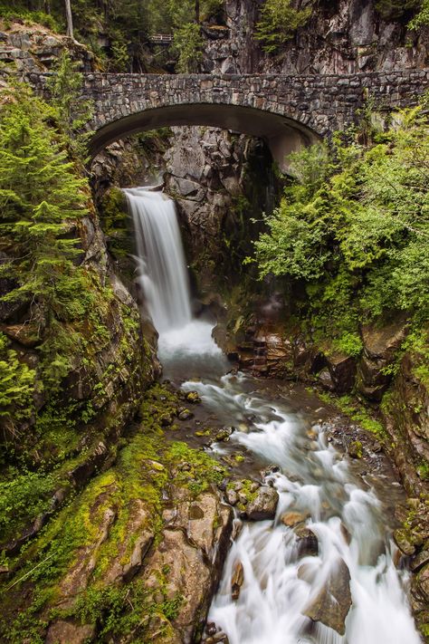 Christine Falls: Water Under the Bridge Our visit to Mount Rainier National Park was more of a side trip than a planned photo excursion. I looked forward to a few days of slowing down and letting go of the stress and urgency that often accompany me on my photography trips. So, I hadn't researched my shots the way I normally would. I had seen pictures of Christine Falls before and often thought about capturing this beautiful scene--the idyllic waterfall framed by the charming cobblestone bridge--but I had not researched the location or planned the perfect time to visit. As we entered Mount Rainier National Park and made our way toward Paradise, the most popular destination and central hub for many hikes, something caught my eye. A fleeting glimpse--something vaguely familiar--that tugged at Water Under The Bridge, Under The Bridge, Mount Rainier National Park, Scenic Photography, Rainier National Park, Large Artwork, Aluminum Prints, The Bridge, Mount Rainier