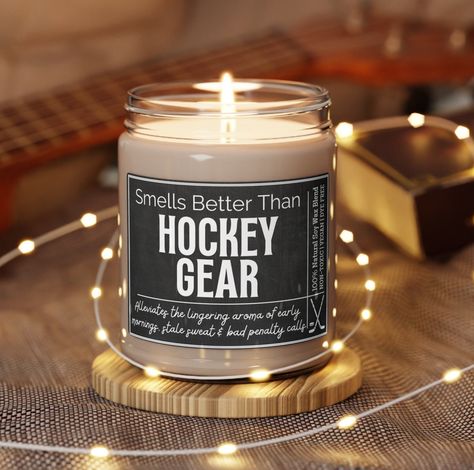 "This Hockey Candle is packed with immersive aromas and available in 5 lovely scents! A fun gift for a Hockey Mom, Hockey Girlfriend, Hockey Coach and more! Contained in a reusable 9oz glass jar (2.8″ × 3.5\") (7.1cm × 8.8cm) and made with 100% natural soy wax blend. Each candle features a 100% cotton wick complete with a fun Hockey themed label.  Candle Facts: Burning time: 50-60 hours | Free of Dyes & Parabens | Vegan | Organic | Assembled in the USA  Original Design by Box Your Occasion (all National Hockey Mom Day Gifts, Gifts For Hockey Coach, Hockey Parent Gifts, Candle Facts, Coach Gift Hockey, Personalized Hockey Gifts, Label Candle, Softball Team Gifts, Soccer Mom Gifts