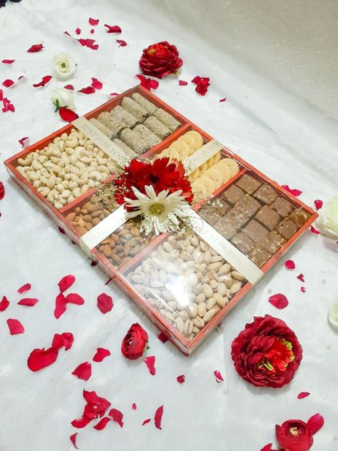 A gift hamper made with rich dry fruits and nuts for engagement, wedding or party events. Link for tray with compartments given below: https://www.amazon.in/MosQuick%C2%AE-Divided-Appetizer-Compartments-Platters/dp/B0C1BY12MS/ref=sr_1_53?crid=2T8XCHVU8T0EW&keywords=tray+with+compartments&qid=1687679616&sprefix=tray+with+compartment%2Caps%2C202&sr=8-53 Nuts Hamper, Dry Fruits Hamper, Engagement Packing Ideas For Bride, Fruits Hamper, Engagement Packing, Dry Fruit Basket, Fruit Hampers, Dry Fruit Tray, Sweet Hampers