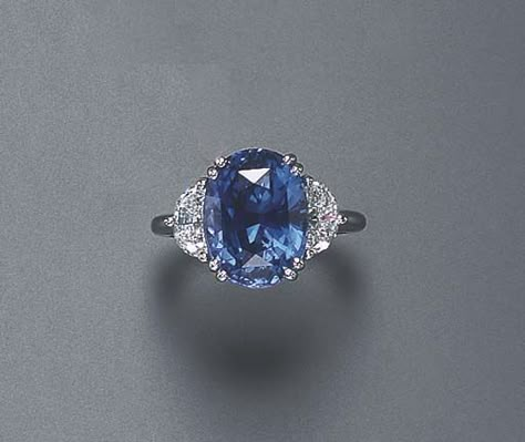 A SAPPHIRE AND DIAMOND RING Set with an oval-cut sapphire, weighing approximately 8.52 carats, flanked on either side by half moon-cut diamonds, mounted in platinum Quality Rings, Sapphire And Diamond Ring, Sapphire Rings, Diamond Ring Settings, Sparkly Things, Fabulous Jewelry, Sapphire Jewelry, Gorgeous Jewelry, Dream Jewelry