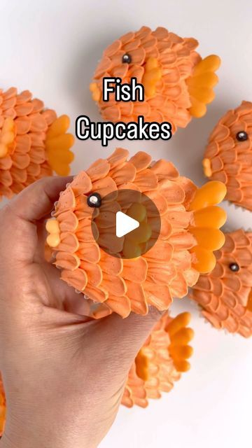 Alex LaRosa on Instagram: "Fish cupcakes 🐟

✨ no fish were harmed in the making of this video

✨ a couple days before you want to make your fish cupcakes make your royal icing transfers for the fins and the mouth

✨ using piping tip 103 pipe petals on your cupcake

✨ placed on your fins and mouth

✨ add your eyeball

Supplies @nycake
Piping tips @wiltoncakes 
Colors @colour.mill 
.
.
.
.
.
#alexlarosabakery #fishcupcakes #orangecupcakes #colourmillmade #summercupcakes #beachcupcakes #lakecupcakes" Fish Cupcakes, Beach Cupcakes, Fishing Cupcakes, Icing Transfers, Summer Cupcakes, Piping Tip, Orange Cupcakes, Royal Icing Transfers, Piping Tips