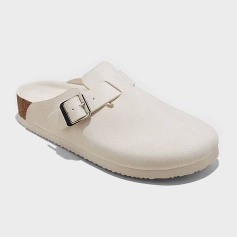 Upgrade your footwear collection with these Betsy Mule Flats from Universal Thread™. These stylish clog mules feature a neutral suede finish to pair with a wide range of casual or dressier outfits for go-to styling. Featuring a round-toe front and an instep strap with a metal buckle accent, they bring on-trend flair to your look. These flat clog mules with a medium shoe width offer comfortable wear, while a slip-on style makes them easy to put on and take off. Universal Thread™: The denim collec Target Clogs, Random Accessories, Clog Mules, Beach Socks, School Shoe, Mule Flats, Wishlist 2024, Mary Jane Ballet Flats, Preppy Shoes