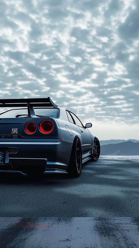 Dark GTR car wallpaper - Unleash the power and intensity of the GTR on your screen with this dark car wallpaper. Experience the sleek design and thrilling vibes. #GTR #CarWallpaper #DarkMode #IntenseVibes Gtr Car Wallpaper, Nissan Skyline Gtr R34 Wallpapers, Gtr R34 Skyline Wallpaper 4k, Rr Car, Car Obsession, Anime Cars, Nissan R34, R34 Skyline, Gtr Car