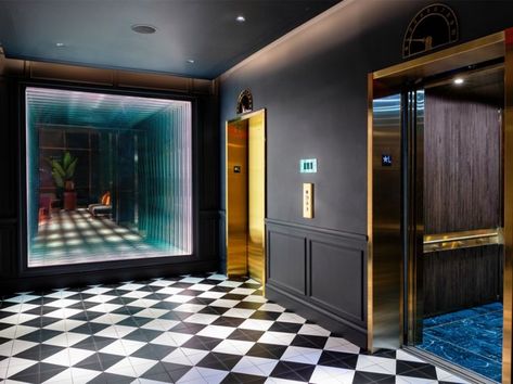 Elevator lobby at the Dream Printer's Alley hotel in Nashville, featuring bold black and white checkered floors with matte black walls and gold elevator doors. Inspiration from Meyer Davis. Printers Alley Nashville, Elevator Lobby Design, Meyer Davis, Miami Hotels South Beach, Stair Elevator, Nashville Hotels, Elevator Lobby, Hotel Lobby Design, South Beach Hotels