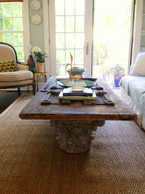 Old door coffee table with wood pedestals. Coffee Table Door, Old Door Coffee Table, Headboard From Old Door, Door Coffee Tables, Door Table, Cat House Diy, Make A Table, Wood Pedestal, Antique Door