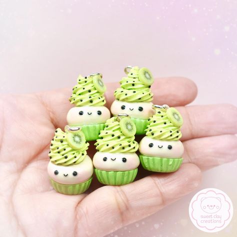 Kiwi Kawaii Cupcake Charms! 🥝🧁#kiwi #kiwicupcakes #kawaiicupcake #kawaiicharm #kawaiijewelry #kawaiiaccessories #charm #cupcakes #polymerclay #clay #polymerckayjewelry #fimo #sculpey #handmade #handmadecharms #handmadejewelry #minifood #miniaturefood #miniaturefoodjewelry #kawaiifood #kawaiifoodjewelry #sweetclaycreations #cute #onlineshop #giftideas Clay Shelf, Craft Miniature, Kawaii Cups, Charm Ideas, Gingerbread Decor, Clay Inspo, Christmas Nutcrackers, Miniature Clay, Cupcake Charms