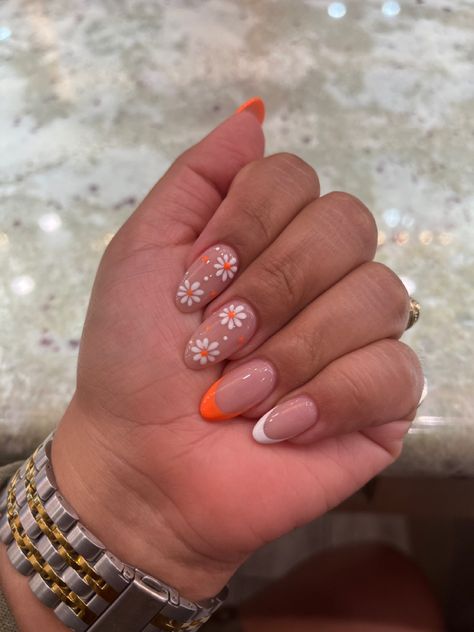 summer nails #flowers #orange #almondnails Summery Flowery Nails, Pastel Orange Nails With Flowers, Orange Nails White Flowers, Almond Nails Orange French Tip, Orange And Flower Nails, Orange And White Short Nails, Summer French Tips With Flowers, Orange Nails Acrylic Square, White And Orange French Tip Nails