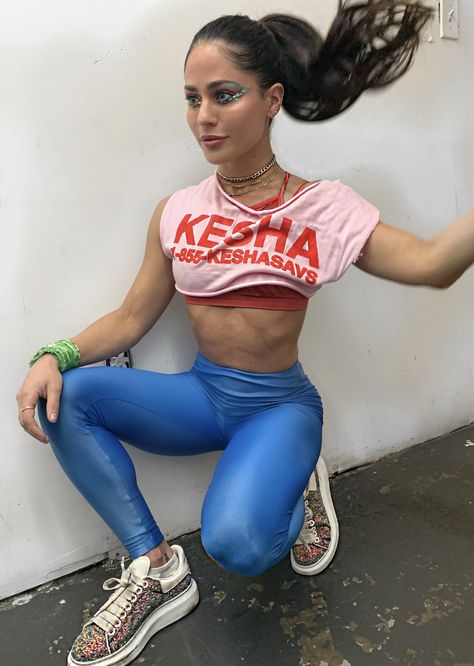 Olivia Amato, Peloton Bike and Tread Instructor Ally Love, Robin Arzon, Peloton Bike, Silver Pants, Class Outfit, Messy Ponytail, The Real World, Get Dressed, Halter Top