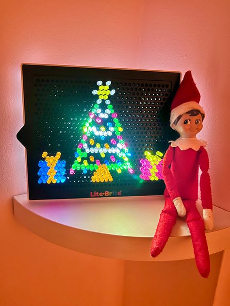 Elf On The Shelf Lego Christmas Tree, Lite Brite Elf On The Shelf, Elf On The Shelf Wrapped In Lights, Elf On The Shelf Glow Sticks, Elf On The Shelf With Lights, Elf On The Shelf Ideas Magnatiles, Elf On Shelf Lego Ideas, Elf On The Shelf Lite Brite, Elf On The Shelf Christmas Lights