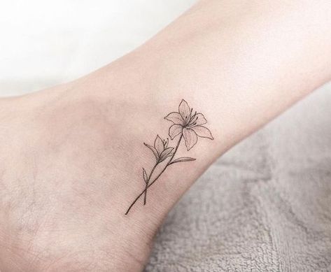 62 Beautiful Ankle Tattoos You May Love to Try! #tattooideas #beautifultattoo #ankletattoo #tattoos Small Lily Tattoo, Tattoos Foot, Lily Tattoos, Lillies Tattoo, Lily Tattoo Design, Lily Flower Tattoos, Anklet Tattoos, Beautiful Flower Tattoos, Flower Tattoo Shoulder