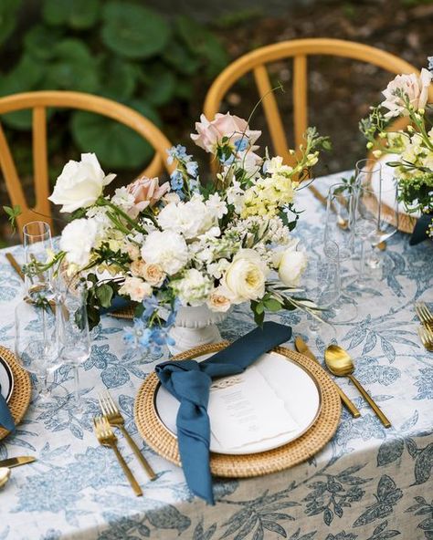 Pattern Tablecloth Wedding, Blue Themed Wedding Reception, Blue And Rattan Wedding, Patterned Wedding Table Linens, Rattan Chargers Table Setting, Rattan Chargers Wedding, Rattan Charger Wedding, Blue Print Tablecloth Wedding, Rattan Chargers Table Setting Wedding