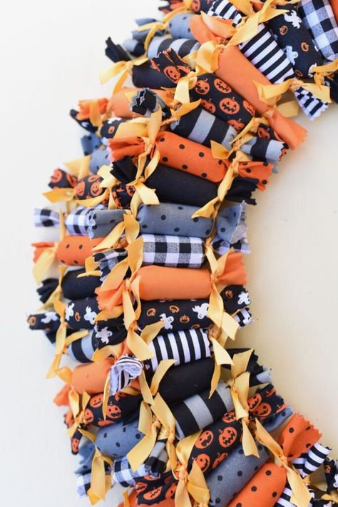 How to make a Halloween wreath Fabric Halloween Wreath, Fabric Strip Wreath, Halloween Wreath Ornaments, Halloween Fabric Wreath, Trendy Tree Wreaths Tutorials Halloween, Halloween Mask Wreath, Candy Wreath, Metal Wreath Frame, Diy Halloween Wreath