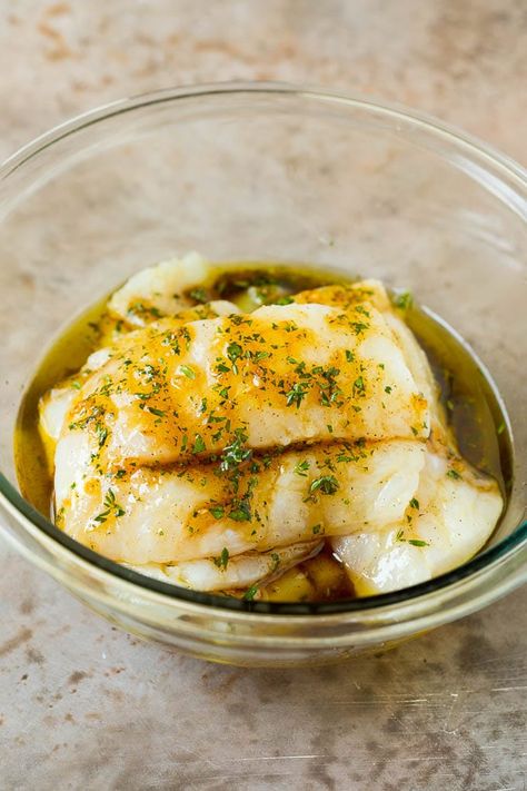 This baked cod is marinated with olive oil, garlic and fresh herbs, then roasted to tender and flaky perfection. Holistic Meals, Cod Baked, Cod Fillet Recipes, Fish Bake, Fillet Recipes, Cod Dishes, Fish Dinners, Fish Marinade, Roasted Cod