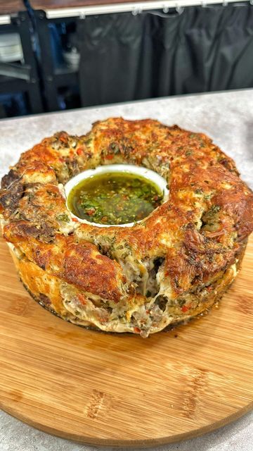 Josh Elkin on Instagram: "Pull Apart Steak and Chimichurri Bread Ingredients below (Makes 12 inch loaf) INGREDIENTS 16oz chopped pizza dough 1 1/2 cups of shredded ribeye 1 1/2 cups grated provolone 1 1/2 cups grated pepper jack CHIMICHURRI (save 1/2 cup for dipping) 2 cups chopped flat leaf parsley 1 cup chopped red chilis 1/2 cup red wine vinegar 1/4 cup chopped garlic 1/4 cup dried oregano 2 cups olive oil Season with salt and pepper" Pull Apart Steak And Chimichurri Bread, Steak And Chimichurri, Hawaii Bbq, Gameday Recipes, Josh Elkin, Chimichurri Steak, Pull Apart Pizza Bread, Bread Pull Apart Recipes, Chimichurri Sauce