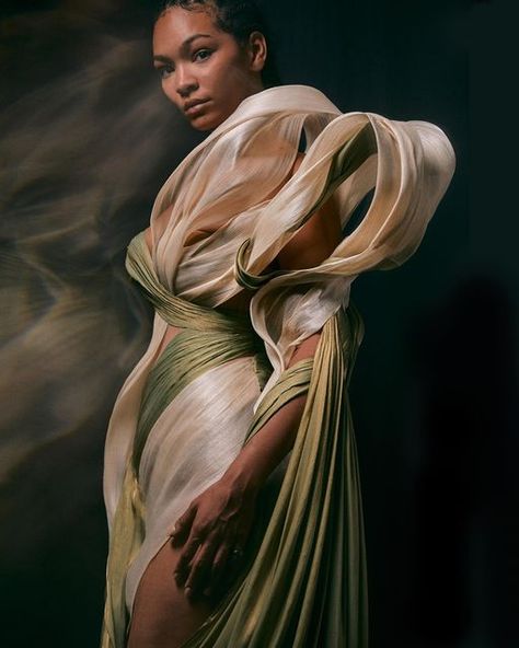 Iris van Herpen Official on Instagram: "Draping details~ The ‘Genesis’ dress is made from sustainable off-white banana leaf fabric and greeny-gold satin. They’re softly draped to entwine and asymmetrically float down from the see-through corset, historic drape references are combined with sculptural banana leaf folds.  ~ #irisvanherpen #metamorphism #hautecouture #pariscoutureweek #parisfashionweek" Sculpture Fashion, Leaf Fabric, Victorian Romance, Draping Fashion, Conceptual Fashion, Iris Van Herpen, Gold Satin, Caravaggio, Banana Leaf