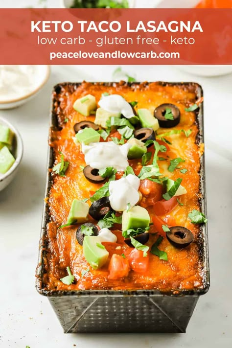 This Keto Taco Lasagna is a delicious way to switch up your taco Tuesday routine. All the delicious flavors of a taco, but in a low carb and gluten free lasagna. Layers of keto noodles, topped with saucy, perfectly seasoned, ground beef, diced tomatoes, green chilies, cheese and olives. Then baked and topped with sour cream, avocado, tomatoes and cilantro. It’s the perfect low carb casserole recipe. Keto Taco Lasagna, Tuesday Routine, Lasagna Layers, Cheese And Olives, Keto Noodles, Peace Love And Low Carb, Taco Lasagna, Low Carb Noodles, Gluten Free Lasagna