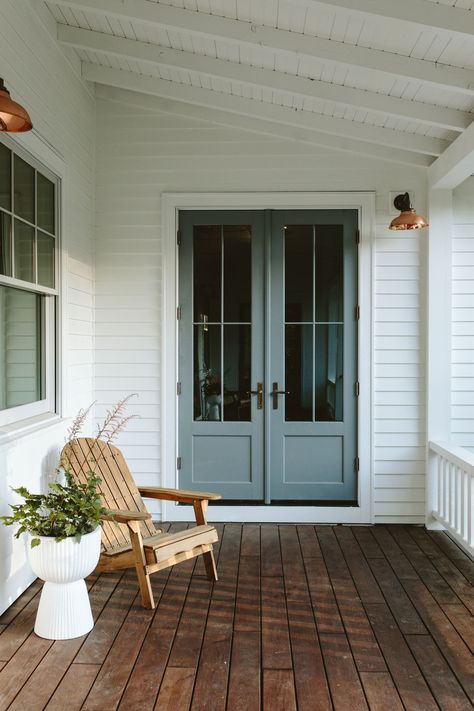 Our Farmhouse Back Porch Reveal – The "1st Summer" Edition! - Emily Henderson Farmhouse Bungalow Exterior, Blue Exterior Door, Weatherboard Exterior, Porch Decorating Summer, Farmhouse Back Porch, Entry Porch, Front Verandah, Cottage Porch, Hampton Bays