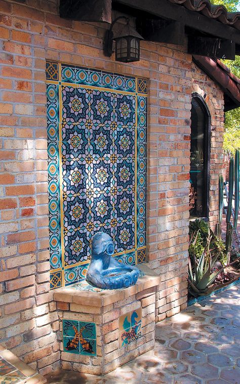 Tile and recycled yellow brick set off a lovely drinking fountain with a mythical sea creature theme Fountain Tile, Outdoor Wall Fountains, Moroccan Garden, Fountain Design, Mexican Home, Patio Wall, Outdoor Fountain, Spanish Style Homes, Hacienda Style