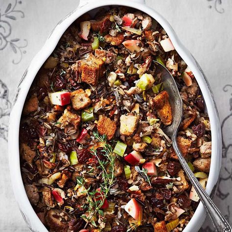 This amazing wild-rice stuffing recipe is bursting with fall flavors, including rye bread, sausage, apples, dried cherries, pecans and fresh herbs. Wild Rice Stuffing Recipes, Rice Stuffing Recipes, Wild Rice Stuffing, Fall Casseroles, Mushroom Stuffing, Thanksgiving Casserole, Rice Stuffing, Apple Sausage, Stuffing Recipes