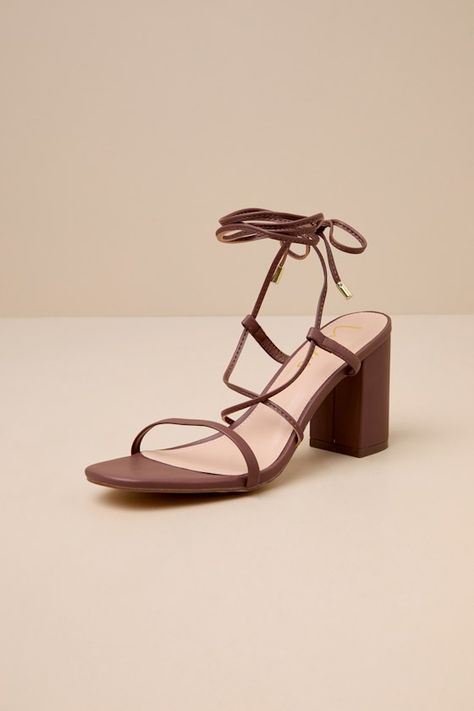 The Lulus Aribaa Brown Lace-Up High Heel Sandals will be your new fave shoes that give any look the perfect finishing touch! Smooth vegan leather shapes these chic heels featuring a slender toe band and matching laces (with gold aglets) that crisscross at the vamp before wrapping and securing at the ankle. 3. 5" block heel. Cushioned insole. Rubber sole has nonskid markings. All vegan friendly, All man-made materials. Imported. Lulus | Aribaa Brown Lace-Up High Heel Sandal Heels | Size 5 | Vegan Cute Brown Heels, Brown Wedding Shoes, Dark Brown Heels, Wrap Up Heels, Bridesmaids Heels, Graduation Shoes, Wrap Around Heels, Brown Strappy Sandals, Brown Sandals Heels