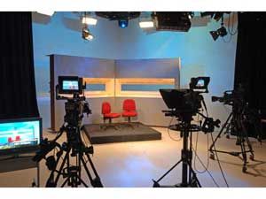 Re-Purpose Your TV Studio for Web Broadcasting | Education World Newsroom Studio Design, Newsroom Studio Background, Interview Background Setup, Tv Studio Design, Photography Studio Spaces, School Tv, Tv Studio, Studio Spaces, Podcast Studio