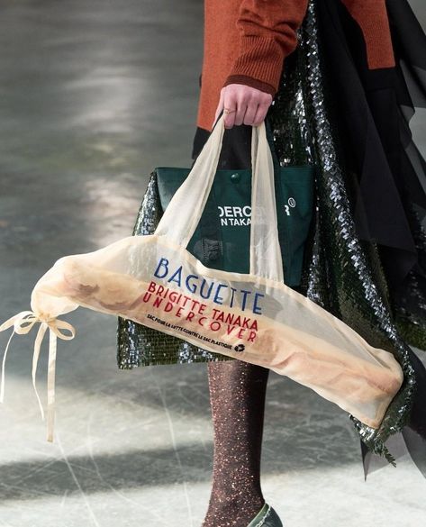 It's no longer about looking like a snack: it's all about carrying one.⁠ ⁠ Fashion designers must've been starved for inspiration this season because they ordered up a heaping helping of food-shaped handbags for Fall/Winter 2024.⁠ ⁠ Moschino and UNDERCOVER were truly in sync: the former carbed up with baguette-shaped clutches while the latter created totes large enough to carry a large loaf of French bread or a bread-shaped bag, at least.⁠ Over at LOEWE, the vibe was deliciously indulgent. Cr... Looking Like A Snack, Baguette Bread, Winter Bags, Bread Bags, In Sync, Fall Winter 2024, French Bread, Baguette Bag, Digital Book