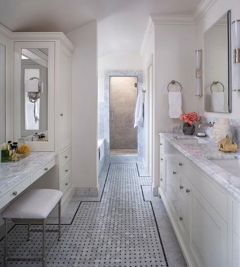 Gray marble basketweave bathroom floor tiles are accented with black border trim tiles and positioned beneath a white vanity stool placed beneath a white makeup vanity with a marble top. Basketweave Tile Bathroom, Basketweave Tile, Tile Bathroom Floor, Transitional Bathroom Design, Basket Weave Tile, Marble Bathroom Floor, Floor Tiles Design, Bathroom Big, Marble Tile Bathroom