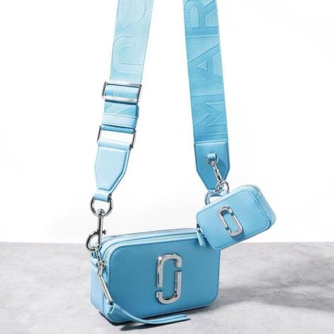 • Marc Jacobs "The Snapshot" crossbody bag in leather  • Features signature double J logo  • Detachable, adjustable logo web crossbody strap, 26.8" drop • Double zip top closures  • Exterior, one back slip pocket and one detachable zip pouch bag  • Interior, one slip pocket  • Approx. 4.1"H x 7.1"W x 2.4"D • Saffiano leather Marc Jabos Snapshot Bag, Marc Jacobs Snapshot Bag White, Mark Jacob’s Bag, Aesthetic Shoulder Bag, J Logo, Marc Jacobs Snapshot Bag, Camera Bag Purse, Marc Jacobs Crossbody Bag, Marc Jacobs Purse