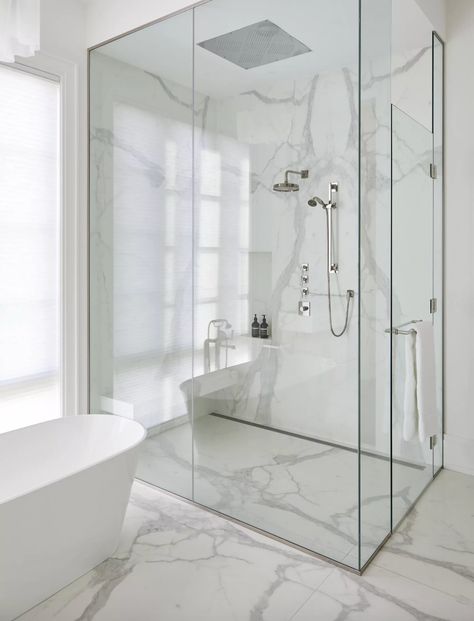 Project Dexshire's bath features this gorgeous walk-in shower with ample space and ventilation. For a good steamy, spa-like experience on the daily, the homeowners opted for this design with Dvira and her team. The marble from floor to ceiling creates an illusion for the eyes and paired with silver fixtures, it is minimal and elegant all at once.⁠ Soaking Tub Shower Combo, Shower Combo, Primary Bathroom, Tub Shower, Floor To Ceiling, The Marble, Tub Shower Combo, Soaking Tub, Walk In Shower