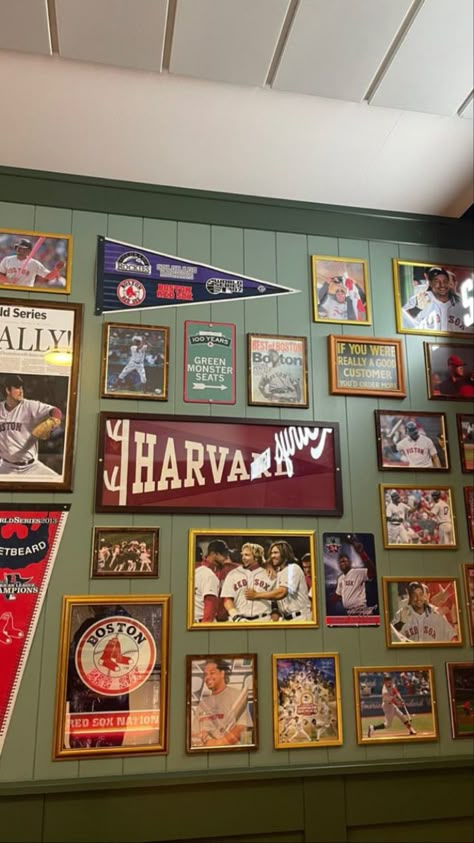 Sports Photo Display Ideas, Baseball Card Wall Display Ideas, Man Cave Picture Wall, Sports Photo Wall Display, Sport Theme Basement Ideas, Modern Sports Basement, Framed Sports Memorabilia, Tasteful Sports Decor Man Cave, Sports Theme Basement Ideas Decor