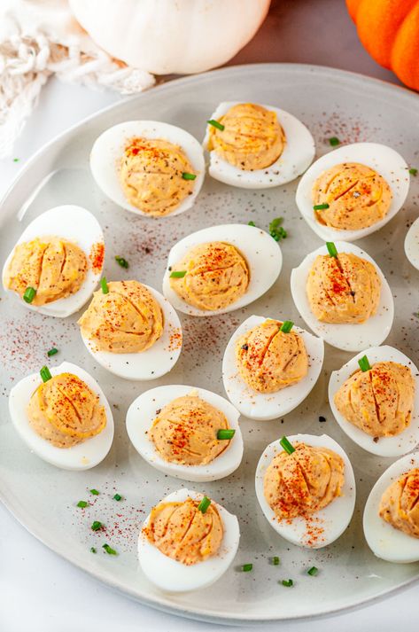 Thanksgiving Pumpkin Deviled Eggs - Festively decorated deviled eggs with paprika, turmeric, and cumin for a "pumpkin" orange hue. The perfect Thanksgiving appetizer! From aberdeenskitchen.com #Thanksgiving #pumpkin #deviledeggs #appetizer #snack #recipe #glutenfree #vegetarian Original Deviled Eggs Recipe, Deviled Eggs Thanksgiving, Easy Halloween Food Appetizers, Pumpkin Deviled Eggs, Egg Appetizer, Thanksgiving Deviled Eggs, Spiced Eggs, Halloween Appetizers Easy, Halloween Food Dinner