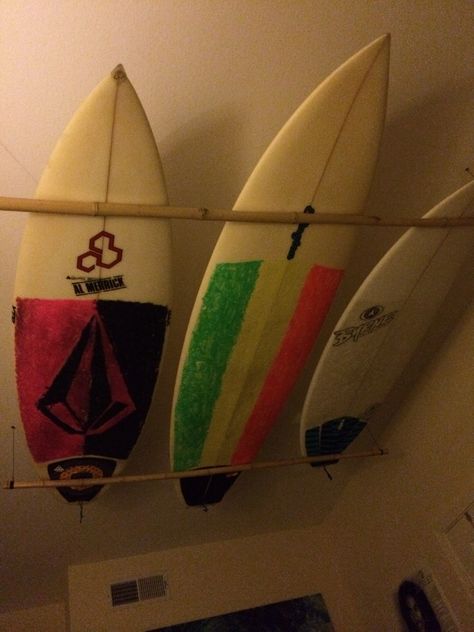 Surfboards hung from the ceiling. Surfboard On Ceiling, Modern Facade, Surfboard Rack, Board Room, Surf Decor, One Of One, Bathroom Designs, Shoe Closet, Olive Tree