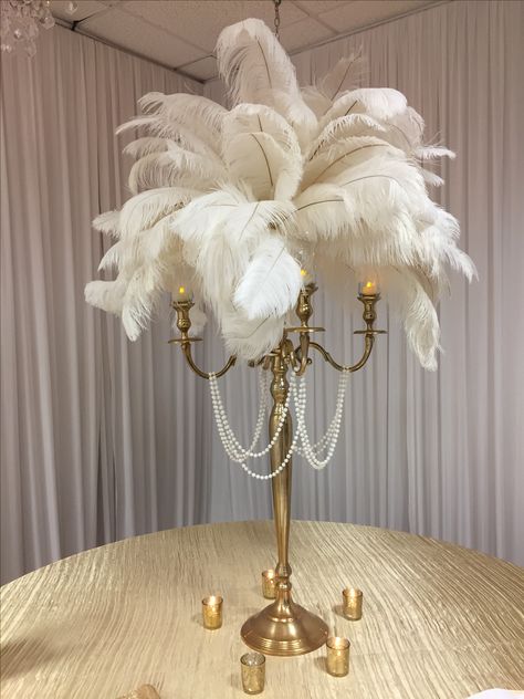 White feathers, candelabra, the pearls will be removed.  This will be on black table cloth with gold sequin runner.  Very elegant and will add gold and cream holiday balls. Victorian Speakeasy, Black And White Masquerade Party, Hollywood Homecoming, Masquerade Gala, Gala Centerpieces, 20s Party Decorations, Tables Centerpieces, Pretty Wedding Bouquet, Gatsby Birthday Party