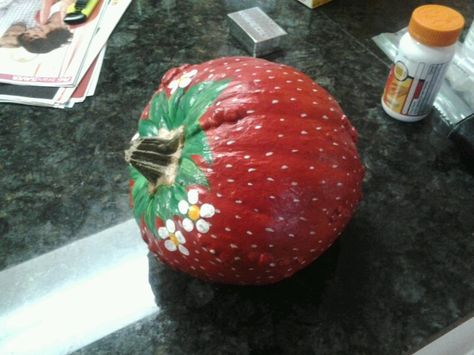 Pumpkin painted like a strawberry! Strawberry Pumpkin Decorating, Watermelon Pumpkin Painting, Strawberry Painted Pumpkin, Fruit Pumpkin Painting Ideas, Food Themed Pumpkin Decorating, Strawberry Shortcake Pumpkin Painting, Cheetah Pumpkin Painting, Pumpkin Painting Ideas Coquette, Pumpkin Decorating No Carving