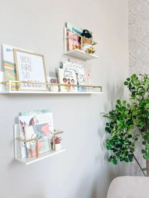 Cecelia's Nursery Reveal - Taryn Newton Acrylic Bookcase, Flower Floor Lamp, Kids Shelves, Flower Mirror, Baby Mattress, Gold Book, Modern End Tables, Nursery Storage, Pink Nursery