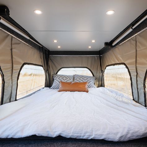 Ever thought of installing a pop-top instead of buying a high-roof van? This one is a good example of what the best of both worlds look like! #vanlife #DIY #vanlifecustoms #sprinter #transit #ford #campervan #conversion #vanconversion #overland #poptop #ideas Beetle Kill Pine, Grey Water System, Pine Cabinets, Campervan Conversion, Drinking Water Filter, Custom Computer, Pop Top, Custom Vans, Under Cabinet Lighting