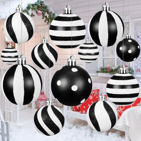 Big Porch Christmas Decor, Nightmare Before Christmas Tree Decor, Pink Black And White Christmas Tree, Oversized Outdoor Christmas Decorations, Black Christmas Tree With Pink Ornaments, Christmas Decor Ideas Black And White, Black White And Red Christmas Tree, Pink And Black Christmas Decor, Black White And Red Christmas Decor