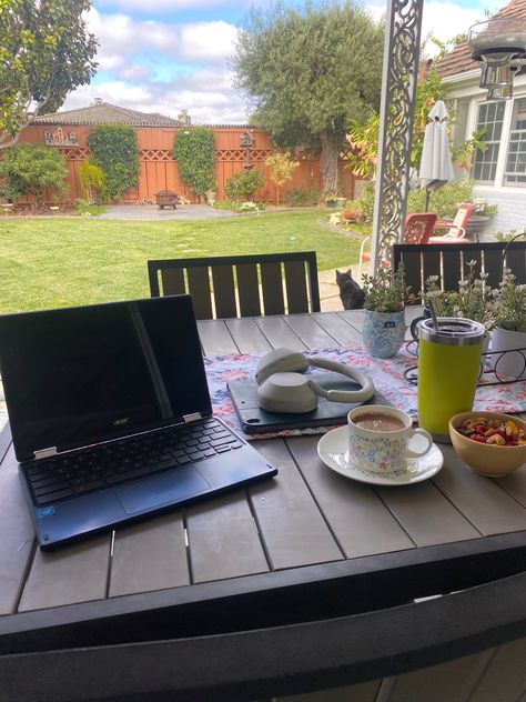 Aesthetic work/study set up on patio table with coffee, snacks, water, headphones, iPad, & laptop Work Outside Aesthetic, Yard Work Aesthetic, Ipad Headphones, Fruit Granola, Outside Aesthetic, Backyard Goals, Aesthetic Studying, Granola Aesthetic, Work Grind