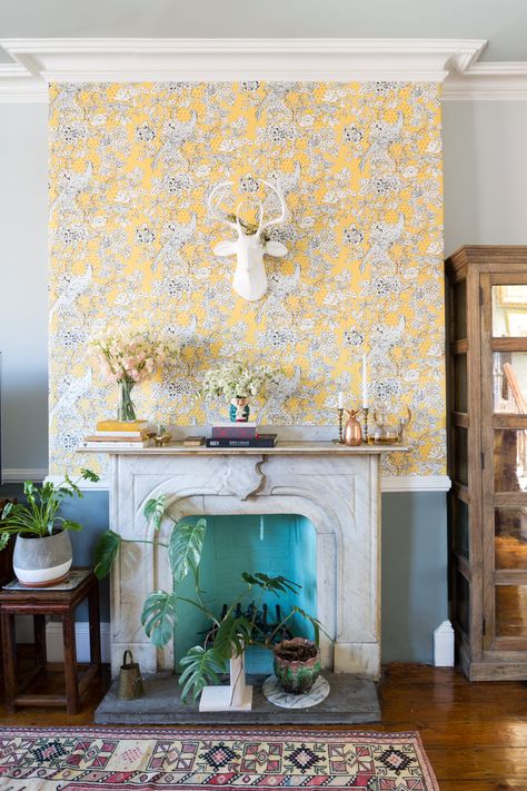 Bold and bright wallpaper from Anthropologie makes this fireplace and mantel surround a showstopper. Li occasionally changes and updates her mantel decorations with the season! Fireplace Wall Wallpaper, Wallpaper Over Fireplace, Anthropologie Fireplace, Wallpaper Fireplace Wall, Fancy Fireplace, How To Wallpaper, Wallpaper Fireplace, Wallpaper Walls, Living Room Decor Tips